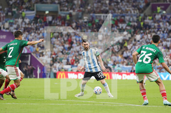 2022-11-26 - Lionel Messi of Argentina and Nestor Araujo, Kevin Alvarez of Mexico during the FIFA World Cup 2022, Group C football match between Argentina and Mexico on November 26, 2022 at Lusail Stadium in Al Daayen, Qatar - FOOTBALL - WORLD CUP 2022 - ARGENTINA V MEXICO - FIFA WORLD CUP - SOCCER
