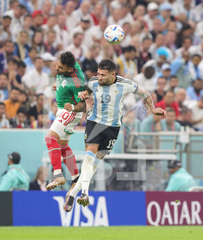 2022-11-26 - Nicolas Otamendi of Argentina and Alexis Vega of Mexico during the FIFA World Cup 2022, Group C football match between Argentina and Mexico on November 26, 2022 at Lusail Stadium in Al Daayen, Qatar - FOOTBALL - WORLD CUP 2022 - ARGENTINA V MEXICO - FIFA WORLD CUP - SOCCER