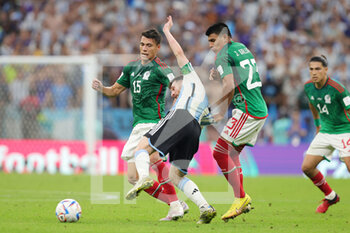 2022-11-26 - Lionel Messi of Argentina and Hector Moreno, Jesus Gallardo of Mexico during the FIFA World Cup 2022, Group C football match between Argentina and Mexico on November 26, 2022 at Lusail Stadium in Al Daayen, Qatar - FOOTBALL - WORLD CUP 2022 - ARGENTINA V MEXICO - FIFA WORLD CUP - SOCCER