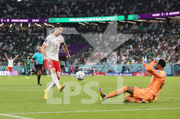 2022-11-26 - Robert Lewandowski of Poland in duel with Mohammed Al Owais of Saudi Arabia during the FIFA World Cup 2022, Group C football match between Poland and Saudi Arabia on November 26, 2022 at Education City Stadium in Doha, Qatar - FOOTBALL - WORLD CUP 2022 - POLAND V SAUDI ARABIA - FIFA WORLD CUP - SOCCER