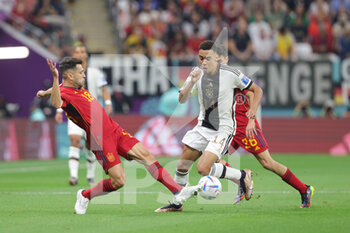2022-11-27 - Jamal Musiala of Germany, Jordi Alba of Spain during the FIFA World Cup 2022, Group E football match between Spain and Germany on November 27, 2022 at Al Bayt Stadium in Al Khor, Qatar - FOOTBALL - WORLD CUP 2022 - SPAIN V GERMANY - FIFA WORLD CUP - SOCCER