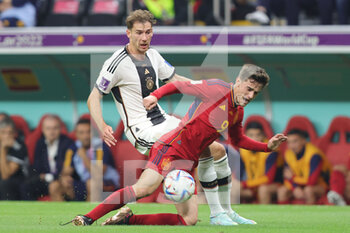 2022-11-27 - Gavi of Spain, Leon Goretzka of Germany during the FIFA World Cup 2022, Group E football match between Spain and Germany on November 27, 2022 at Al Bayt Stadium in Al Khor, Qatar - FOOTBALL - WORLD CUP 2022 - SPAIN V GERMANY - FIFA WORLD CUP - SOCCER