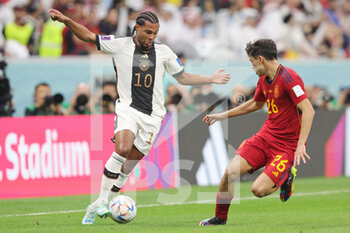 2022-11-27 - Serge Gnabry of Germany, Pedri of Spain during the FIFA World Cup 2022, Group E football match between Spain and Germany on November 27, 2022 at Al Bayt Stadium in Al Khor, Qatar - FOOTBALL - WORLD CUP 2022 - SPAIN V GERMANY - FIFA WORLD CUP - SOCCER