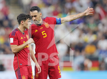 2022-11-27 - Pedri and Sergio Busquets of Spain during the FIFA World Cup 2022, Group E football match between Spain and Germany on November 27, 2022 at Al Bayt Stadium in Al Khor, Qatar - FOOTBALL - WORLD CUP 2022 - SPAIN V GERMANY - FIFA WORLD CUP - SOCCER