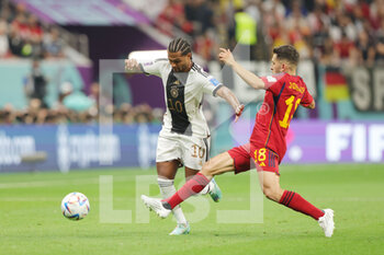 2022-11-27 - Serge Gnabry of Germany and Jordi Alba of Spain during the FIFA World Cup 2022, Group E football match between Spain and Germany on November 27, 2022 at Al Bayt Stadium in Al Khor, Qatar - FOOTBALL - WORLD CUP 2022 - SPAIN V GERMANY - FIFA WORLD CUP - SOCCER