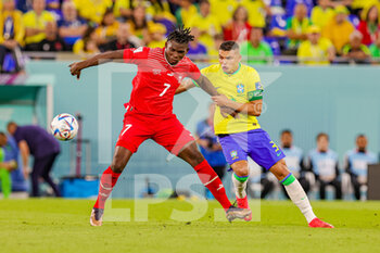 2022-11-29 - Thiago Silva (3) of Brazil tussles with Breel Embolo (7) of Switzerland during the FIFA World Cup 2022, Group G football match between Brazil and Switzerland on November 28, 2022 at Stadium 974 in Doha, Qatar - FOOTBALL - WORLD CUP 2022 - BRAZIL V SWITZERLAND - FIFA WORLD CUP - SOCCER