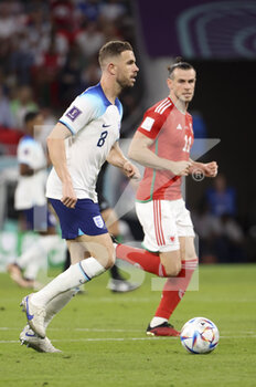2022-11-29 - Jordan Henderson of England, Gareth Bale of Wales during the FIFA World Cup 2022, Group B football match between Wales and England on November 29, 2022 at Ahmad Bin Ali Stadium in Ar-Rayyan, Qatar - FOOTBALL - WORLD CUP 2022 - WALES V ENGLAND - FIFA WORLD CUP - SOCCER