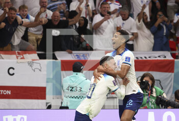 2022-11-29 - Phil Foden of England celebrates his goal with Jude Bellingham during the FIFA World Cup 2022, Group B football match between Wales and England on November 29, 2022 at Ahmad Bin Ali Stadium in Ar-Rayyan, Qatar - FOOTBALL - WORLD CUP 2022 - WALES V ENGLAND - FIFA WORLD CUP - SOCCER