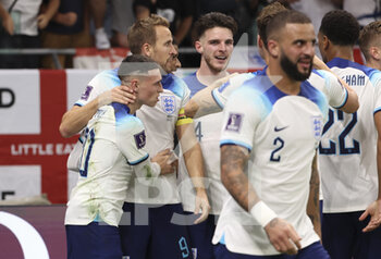 2022-11-29 - Phil Foden of England celebrates his goal with Harry Kane and teammates during the FIFA World Cup 2022, Group B football match between Wales and England on November 29, 2022 at Ahmad Bin Ali Stadium in Ar-Rayyan, Qatar - FOOTBALL - WORLD CUP 2022 - WALES V ENGLAND - FIFA WORLD CUP - SOCCER