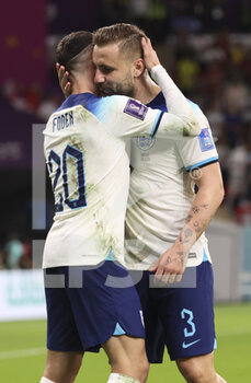 2022-11-29 - Phil Foden of England celebrates his goal with Luke Shaw during the FIFA World Cup 2022, Group B football match between Wales and England on November 29, 2022 at Ahmad Bin Ali Stadium in Ar-Rayyan, Qatar - FOOTBALL - WORLD CUP 2022 - WALES V ENGLAND - FIFA WORLD CUP - SOCCER