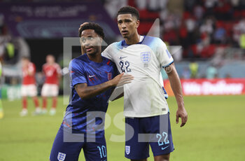 2022-11-29 - Raheem Sterling, Jude Bellingham of England celebrate the victory following the FIFA World Cup 2022, Group B football match between Wales and England on November 29, 2022 at Ahmad Bin Ali Stadium in Ar-Rayyan, Qatar - FOOTBALL - WORLD CUP 2022 - WALES V ENGLAND - FIFA WORLD CUP - SOCCER