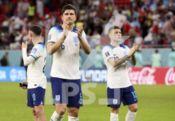 2022-11-29 - Harry Maguire, Kieran Trippier of England celebrate the victory following the FIFA World Cup 2022, Group B football match between Wales and England on November 29, 2022 at Ahmad Bin Ali Stadium in Ar-Rayyan, Qatar - FOOTBALL - WORLD CUP 2022 - WALES V ENGLAND - FIFA WORLD CUP - SOCCER