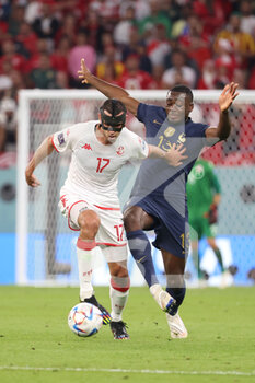 2022-11-30 - Ellyes Skhiri of Tunisia, Youssouf Fofana of France during the FIFA World Cup 2022, Group D football match between Tunisia and France on November 30, 2022 at Education City Stadium in Doha, Qatar - FOOTBALL - WORLD CUP 2022 - TUNISIA V FRANCE - FIFA WORLD CUP - SOCCER