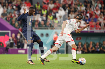 2022-11-30 - Ousmane Dembele of France, Ellyes Skhiri of Tunisia during the FIFA World Cup 2022, Group D football match between Tunisia and France on November 30, 2022 at Education City Stadium in Doha, Qatar - FOOTBALL - WORLD CUP 2022 - TUNISIA V FRANCE - FIFA WORLD CUP - SOCCER