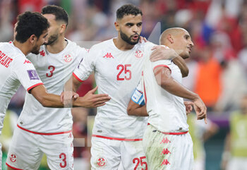 2022-11-30 - Wahbi Khazri of Tunisia celebrates his goal 1-0 with Anis Slimane during the FIFA World Cup 2022, Group D football match between Tunisia and France on November 30, 2022 at Education City Stadium in Doha, Qatar - FOOTBALL - WORLD CUP 2022 - TUNISIA V FRANCE - FIFA WORLD CUP - SOCCER