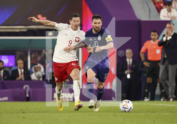 2022-11-30 - Robert Lewandowski of Poland, Lionel Messi of Argentina during the FIFA World Cup 2022, Group C football match between Poland and Argentina on November 30, 2022 at Stadium 974 in Doha, Qatar - FOOTBALL - WORLD CUP 2022 - POLAND V ARGENTINA - FIFA WORLD CUP - SOCCER