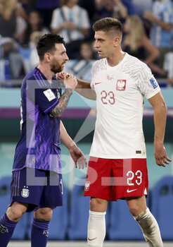 2022-11-30 - Lionel Messi of Argentina salutes Krzysztof Piatek of Poland following the FIFA World Cup 2022, Group C football match between Poland and Argentina on November 30, 2022 at Stadium 974 in Doha, Qatar - FOOTBALL - WORLD CUP 2022 - POLAND V ARGENTINA - FIFA WORLD CUP - SOCCER