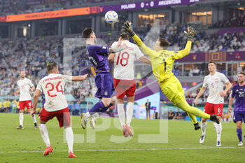 2022-11-30 - Goalkeeper Wojciech Szczesny of Poland fouls Lionel Messi of Argentina during the FIFA World Cup 2022, Group C football match between Poland and Argentina on November 30, 2022 at Stadium 974 in Doha, Qatar - FOOTBALL - WORLD CUP 2022 - POLAND V ARGENTINA - FIFA WORLD CUP - SOCCER