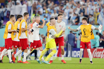 2022-11-30 - Poland players celebrate the qualification at full time during the FIFA World Cup 2022, Group C football match between Poland and Argentina on November 30, 2022 at Stadium 974 in Doha, Qatar - FOOTBALL - WORLD CUP 2022 - POLAND V ARGENTINA - FIFA WORLD CUP - SOCCER