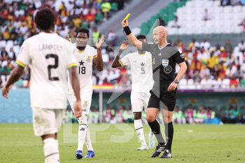 2022-11-28 - Daniel Amartey of Ghana receives a yellow card from referee Anthony Taylor of England during the FIFA World Cup 2022, Group H football match between South Korea Republic and Ghana on November 28, 2022 at Education City Stadium in Doha, Qatar - FOOTBALL - WORLD CUP 2022 - KOREA REPUBLIC V GHANA - FIFA WORLD CUP - SOCCER