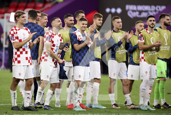 2022-12-01 - Players of Croatia celebrate the victory with the fans following the FIFA World Cup 2022, Group F football match between Croatia and Belgium on December 1, 2022 at Ahmad Bin Ali Stadium in Ar-Rayyan, Qatar - FOOTBALL - WORLD CUP 2022 - CROATIA V BELGIUM - FIFA WORLD CUP - SOCCER