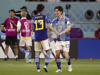 2022-12-01 - Ao Tanaka of Japan celebrates his goal with Hidemasa Morita (left) during the FIFA World Cup 2022, Group E football match between Japan and Spain on December 1, 2022 at Khalifa International Stadium in Ar-Rayyan, Qatar - FOOTBALL - WORLD CUP 2022 - JAPAN V SPAIN - FIFA WORLD CUP - SOCCER