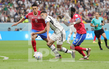 2022-12-01 - Jamal Musiala of Germany, Oscar Duarte and Keysher Fuller of Costa Rica during the FIFA World Cup 2022, Group E football match between Costa Rica and Germany on December 1, 2022 at Al Bayt Stadium in Al Khor, Qatar - FOOTBALL - WORLD CUP 2022 - COSTA RICA V GERMANY - FIFA WORLD CUP - SOCCER