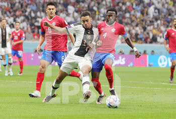 2022-12-01 - Jamal Musiala of Germany, Keysher Fuller of Costa Rica during the FIFA World Cup 2022, Group E football match between Costa Rica and Germany on December 1, 2022 at Al Bayt Stadium in Al Khor, Qatar - FOOTBALL - WORLD CUP 2022 - COSTA RICA V GERMANY - FIFA WORLD CUP - SOCCER