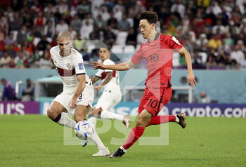 2022-12-02 - Lee Jae-Song of South Korea, Pepe of Portugal (left) during the FIFA World Cup 2022, Group H football match between Korea Republic and Portugal on December 2, 2022 at Education City Stadium in Doha, Qatar - FOOTBALL - WORLD CUP 2022 - KOREA REPUBLIC V PORTUGAL - FIFA WORLD CUP - SOCCER