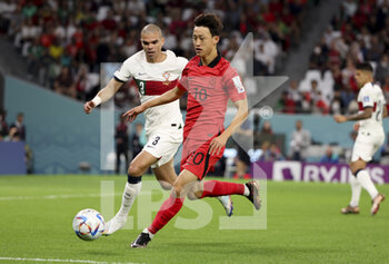 2022-12-02 - Lee Jae-Song of South Korea, Pepe of Portugal (left) during the FIFA World Cup 2022, Group H football match between Korea Republic and Portugal on December 2, 2022 at Education City Stadium in Doha, Qatar - FOOTBALL - WORLD CUP 2022 - KOREA REPUBLIC V PORTUGAL - FIFA WORLD CUP - SOCCER