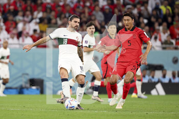2022-12-02 - Ruben Neves of Portugal, Jung Woo-Young of South Korea during the FIFA World Cup 2022, Group H football match between Korea Republic and Portugal on December 2, 2022 at Education City Stadium in Doha, Qatar - FOOTBALL - WORLD CUP 2022 - KOREA REPUBLIC V PORTUGAL - FIFA WORLD CUP - SOCCER
