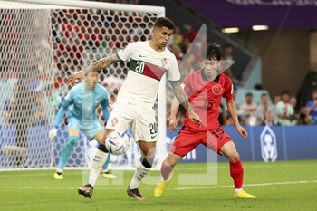 2022-12-02 - Joao Cancelo of Portugal, Kim Moon-Hwan of South Korea during the FIFA World Cup 2022, Group H football match between Korea Republic and Portugal on December 2, 2022 at Education City Stadium in Doha, Qatar - FOOTBALL - WORLD CUP 2022 - KOREA REPUBLIC V PORTUGAL - FIFA WORLD CUP - SOCCER