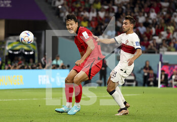 2022-12-02 - Kwon Kyung-Won of South Korea, Ricardo Horta of Portugal during the FIFA World Cup 2022, Group H football match between Korea Republic and Portugal on December 2, 2022 at Education City Stadium in Doha, Qatar - FOOTBALL - WORLD CUP 2022 - KOREA REPUBLIC V PORTUGAL - FIFA WORLD CUP - SOCCER