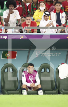 2022-12-02 - Cristiano Ronaldo of Portugal on the bench after being replaced during the FIFA World Cup 2022, Group H football match between Korea Republic and Portugal on December 2, 2022 at Education City Stadium in Doha, Qatar - FOOTBALL - WORLD CUP 2022 - KOREA REPUBLIC V PORTUGAL - FIFA WORLD CUP - SOCCER