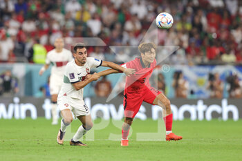 2022-12-02 - Ricardo Horta of Portugal and Jin-su Kim of Korea Republic during the FIFA World Cup 2022, Group H football match between Korea Republic and Portugal on December 2, 2022 at Education City Stadium in Doha, Qatar - FOOTBALL - WORLD CUP 2022 - KOREA REPUBLIC V PORTUGAL - FIFA WORLD CUP - SOCCER