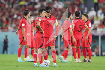 2022-12-02 - Seung-ho Paik and Heung-min Son of Korea Republic during the FIFA World Cup 2022, Group H football match between Korea Republic and Portugal on December 2, 2022 at Education City Stadium in Doha, Qatar - FOOTBALL - WORLD CUP 2022 - KOREA REPUBLIC V PORTUGAL - FIFA WORLD CUP - SOCCER