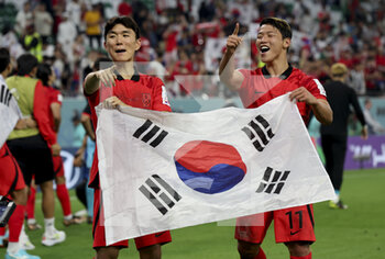 2022-12-02 - Hwang In-Beom, Hwang Hee-Chan of South Korea celebrate the victory following the FIFA World Cup 2022, Group H football match between Korea Republic and Portugal on December 2, 2022 at Education City Stadium in Doha, Qatar - FOOTBALL - WORLD CUP 2022 - KOREA REPUBLIC V PORTUGAL - FIFA WORLD CUP - SOCCER