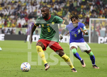 2022-12-02 - Nicolas Moumi Ngamaleu of Cameroon, Frederico Rodrigues de Paula aka Fred of Brazil during the FIFA World Cup 2022, Group G football match between Cameroon and Brazil on December 2, 2022 at Lusail Stadium in Al Daayen, Qatar - FOOTBALL - WORLD CUP 2022 - CAMEROON V BRAZIL - FIFA WORLD CUP - SOCCER