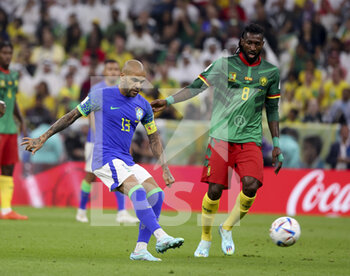 2022-12-02 - Daniel Alves aka Dani Alves of Brazil, Andre-Frank Zambo Anguissa of Cameroon during the FIFA World Cup 2022, Group G football match between Cameroon and Brazil on December 2, 2022 at Lusail Stadium in Al Daayen, Qatar - FOOTBALL - WORLD CUP 2022 - CAMEROON V BRAZIL - FIFA WORLD CUP - SOCCER