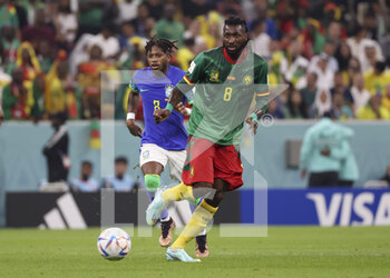 2022-12-02 - Andre-Frank Zambo Anguissa of Cameroon, Frederico Rodrigues de Paula aka Fred of Brazil (left) during the FIFA World Cup 2022, Group G football match between Cameroon and Brazil on December 2, 2022 at Lusail Stadium in Al Daayen, Qatar - FOOTBALL - WORLD CUP 2022 - CAMEROON V BRAZIL - FIFA WORLD CUP - SOCCER