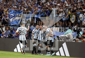 2022-12-03 - Julian Alvarez of Argentina celebrates his goal with Lionel Messi and teammates during the FIFA World Cup 2022, Round of 16 football match between Argentina and Australia on December 3, 2022 at Ahmad Bin Ali Stadium in Al Rayyan, Qatar - FOOTBALL - WORLD CUP 2022 - 1/8 - ARGENTINA V AUSTRALIA - FIFA WORLD CUP - SOCCER