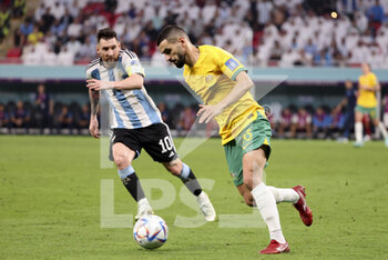 2022-12-03 - Aziz Behich of Australia, Lionel Messi of Argentina (left) during the FIFA World Cup 2022, Round of 16 football match between Argentina and Australia on December 3, 2022 at Ahmad Bin Ali Stadium in Al Rayyan, Qatar - FOOTBALL - WORLD CUP 2022 - 1/8 - ARGENTINA V AUSTRALIA - FIFA WORLD CUP - SOCCER