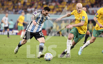 2022-12-03 - Lionel Messi of Argentina, Aaron Mooy of Australia during the FIFA World Cup 2022, Round of 16 football match between Argentina and Australia on December 3, 2022 at Ahmad Bin Ali Stadium in Al Rayyan, Qatar - FOOTBALL - WORLD CUP 2022 - 1/8 - ARGENTINA V AUSTRALIA - FIFA WORLD CUP - SOCCER