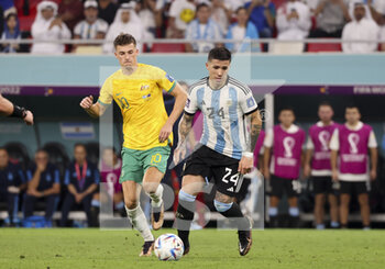 2022-12-03 - Enzo Fernandez of Argentina, Ajdin Hrustic of Australia (left) during the FIFA World Cup 2022, Round of 16 football match between Argentina and Australia on December 3, 2022 at Ahmad Bin Ali Stadium in Al Rayyan, Qatar - FOOTBALL - WORLD CUP 2022 - 1/8 - ARGENTINA V AUSTRALIA - FIFA WORLD CUP - SOCCER