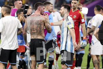 2022-12-03 - Rodrigo De Paul, Lionel Messi of Argentina celebrate the victory following the FIFA World Cup 2022, Round of 16 football match between Argentina and Australia on December 3, 2022 at Ahmad Bin Ali Stadium in Al Rayyan, Qatar - FOOTBALL - WORLD CUP 2022 - 1/8 - ARGENTINA V AUSTRALIA - FIFA WORLD CUP - SOCCER