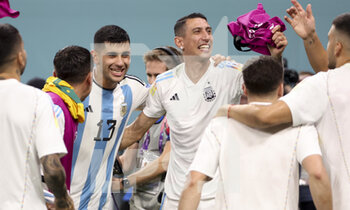 2022-12-03 - Cristian Romero, Angel Di Maria of Argentina celebrate the victory following the FIFA World Cup 2022, Round of 16 football match between Argentina and Australia on December 3, 2022 at Ahmad Bin Ali Stadium in Al Rayyan, Qatar - FOOTBALL - WORLD CUP 2022 - 1/8 - ARGENTINA V AUSTRALIA - FIFA WORLD CUP - SOCCER