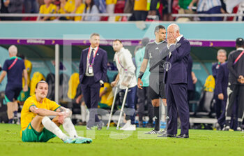 2022-12-04 - Graham Arnold Manager of Australia looks dejected at full time during the FIFA World Cup 2022, Round of 16 football match between Argentina and Australia on December 3, 2022 at Ahmad Bin Ali Stadium in Al Rayyan, Qatar - FOOTBALL - WORLD CUP 2022 - 1/8 - ARGENTINA V AUSTRALIA - FIFA WORLD CUP - SOCCER