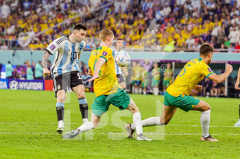 2022-12-04 - Lionel Messi (10) of Argentina, Kye Rowles and Fran Karacic of Australia during the FIFA World Cup 2022, Round of 16 football match between Argentina and Australia on December 3, 2022 at Ahmad Bin Ali Stadium in Al Rayyan, Qatar - FOOTBALL - WORLD CUP 2022 - 1/8 - ARGENTINA V AUSTRALIA - FIFA WORLD CUP - SOCCER