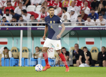 2022-12-04 - Raphael Varane of France during the FIFA World Cup 2022, Round of 16 football match between France and Poland on December 4, 2022 at Al Thumama Stadium in Doha, Qatar - FOOTBALL - WORLD CUP 2022 - 1/8 - FRANCE V POLAND - FIFA WORLD CUP - SOCCER