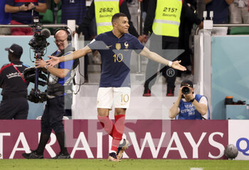2022-12-04 - Kylian Mbappe of France celebrates his second goal during the FIFA World Cup 2022, Round of 16 football match between France and Poland on December 4, 2022 at Al Thumama Stadium in Doha, Qatar - FOOTBALL - WORLD CUP 2022 - 1/8 - FRANCE V POLAND - FIFA WORLD CUP - SOCCER